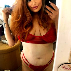 Red-haired woman in lingerie on OnlyFans