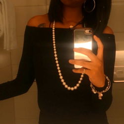 Chic and Stylish Woman in Black Outfit Taking a Selfie