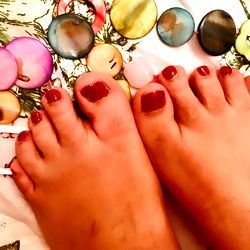 Close-up of a Female's Feet with Manicured Toes and Pedicure