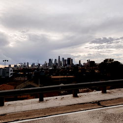 Highway Overpass View of City Skyline