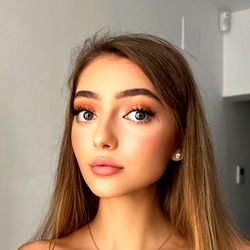 Anna, a young woman with striking features and confident gaze. 💍