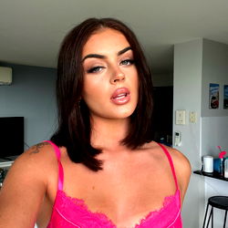 Asia Rae, a striking beauty with short brown hair and piercing eyes