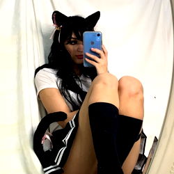 Annie, 25 year old cat girl in a cat ear hat and boots