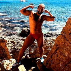 A Shirtless Bodybuilder by the Ocean