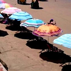 Elevated Umbrellas on Beach in Ecuador