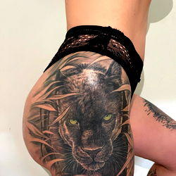 Tattooed Model Showcasing Lion Tattoo