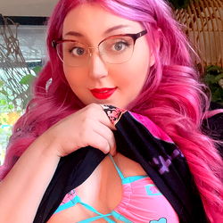 Female OnlyFans Model with Pink Hair and Bra
