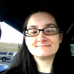 Sporty and Approachable Individual Posing for Photo in Car