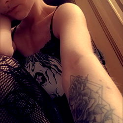 AmQueer in Tattoo-Themed Fishnet Bodysuit