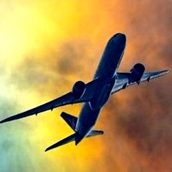 Commercial Airplane Soaring Through Stormy Sky