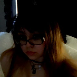 Woman with glasses and choker wearing black top