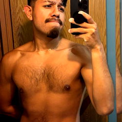 Onlyfans Model Jacob Showing Off His Muscles with a Confident Smirk