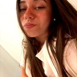 Ariadna Keller in a Stylish White Sweater