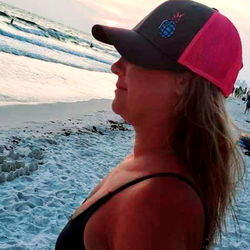 Woman in Pink Hat on Beach