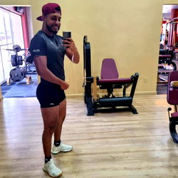 Fitness Enthusiast Posing in Gym