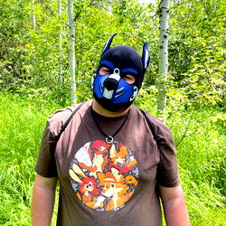 Adult Male in Dog Mask, Exuding Confidence and Whimsy Amidst the Woods