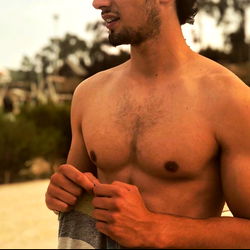 Twink Nudes Model Showcasing Shirtless Beach Scene