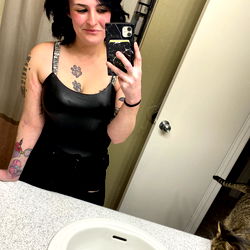 Ariel, a Colorado-based OnlyFans model in black leather