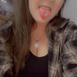 Kayde, a young adult woman with a playful pose and vibrant outfit.