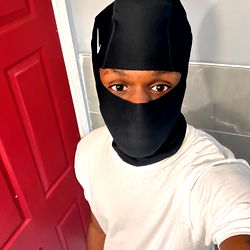 A Man in a Mask Taking a Selfie