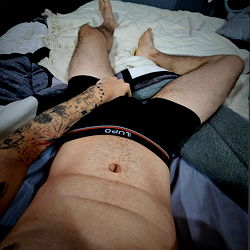 Adult Model in Boxers on Bed