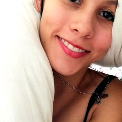 Woman in Tattoo, Smiling at Camera