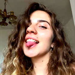 Maelita - Smiling Woman with Piercing