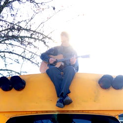 Ben in a school bus sitting on the roof