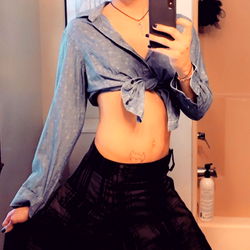 OnlyFans Model in a Stylish Shirt and Skirt