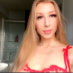 Angel, a Canadian OnlyFans model in a red lingerie
