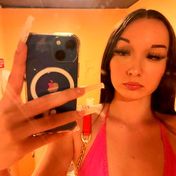 Model in a pink bikini holding a phone