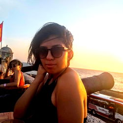 Alexa Blanco poses at sunset by the ocean