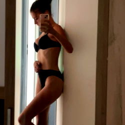 Alina in an Aquitaine-themed setting, showcasing her confidence and fashion sense