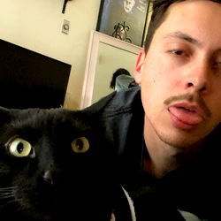 A Young Man and a Cat Share a Moment of Humor