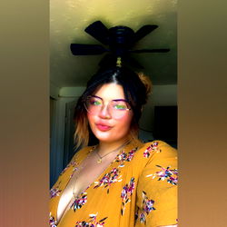 Stylish Woman with Green Eyes in Yellow Dress