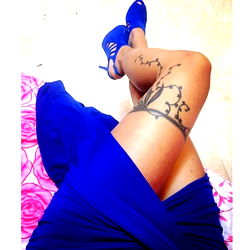 Brown Feet Model Posing with Stylish Blue Tattoo