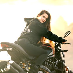 Ricarda Losch, the German Onlyfans Model with Motorcycle on a Beachy Background