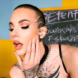 Onlyfans Model Therustyranger Posing with Chalkboard and Bold Makeup