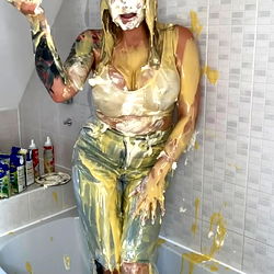Woman Celebrating Golden Shower in Bathtub