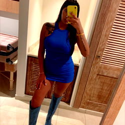 Florencia, a Stunning OnlyFans Model Poses in a Sleek Blue Dress