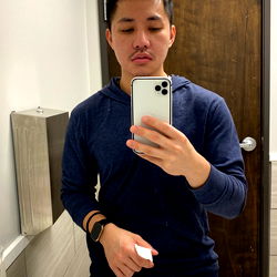 Young Male Model in Bathroom Mirror