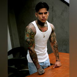 Angel Lugo, Onlyfans Model: Showcasing Tattoos in a Candid Pose