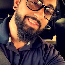 Smiling Man Taking a Selfie from the Driver's Seat