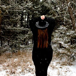 A Woman with Long Hair in a Field