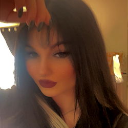 Dahlia, OnlyFans Model with Dark Hair and Red Lipstick