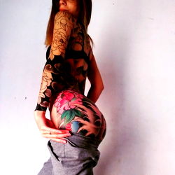 Stylish Tattooed Model Poses for the Camera
