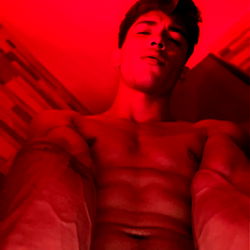 Fitness Model Andrew Thevil Showcasing His Physique with a Camera Flip