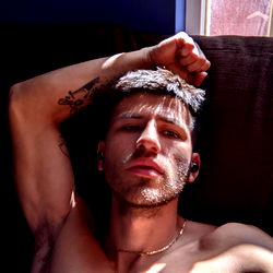 A Young Adult Male Model with Tattoos