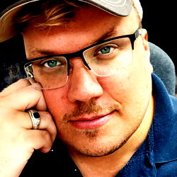 A Man in a Cap and Glasses