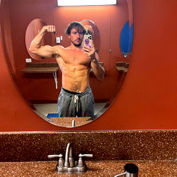 Muscular Fitness Model in Gym Mirror
